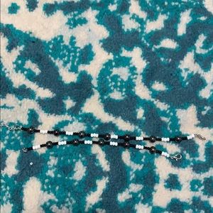 A gray, white and silver bracelet